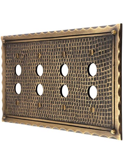 Bungalow Style Quad Push Button Switch Plate In Antique Brass.